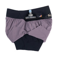Trail Tech Short - Women by Raide Research in purple and black with hydration and nutrition storage, designed for running and outdoor use