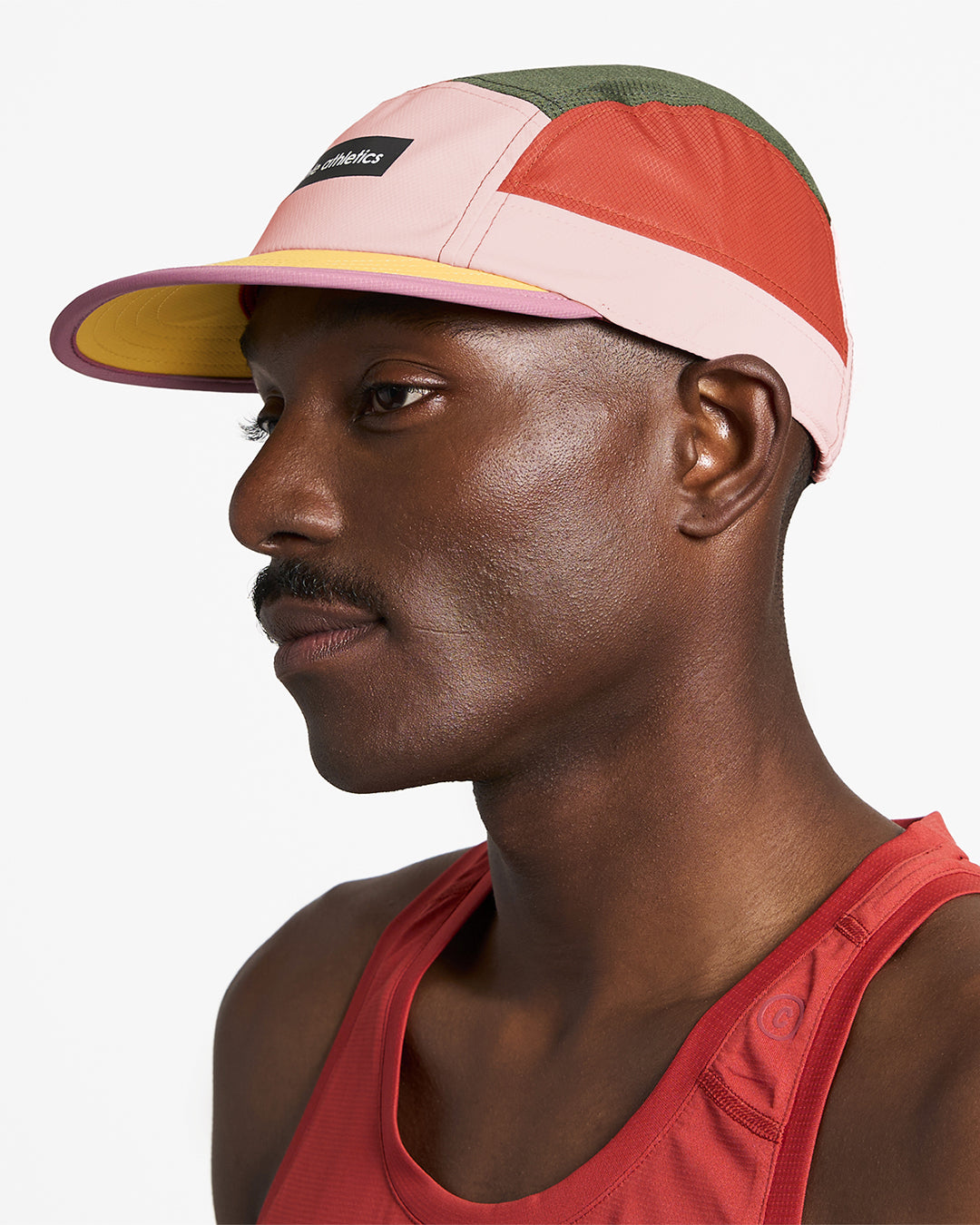 GOCap - Field - IconicBar by Ciele in pink, orange, and green with coolmatic plus flowmesh for ventilation, ideal for running in Canada