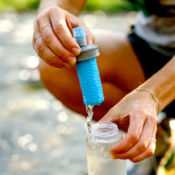 Ultra Flask + 500ml Filter Kit by Hydrapak in clear and blue, lightweight hydration system with compact filter for clean water on the go