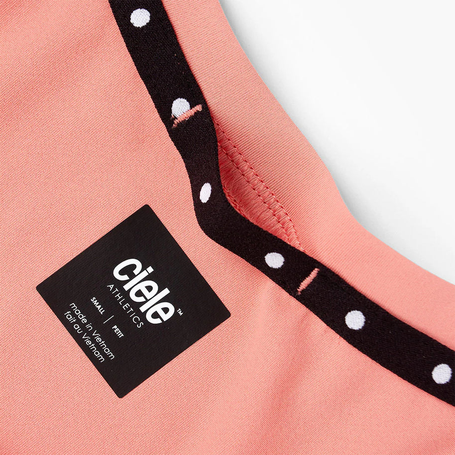 DLY Singlet - Women by Ciele in coral with black and white dot trim, lightweight performance singlet for running and hot weather use