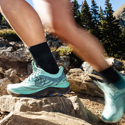 Ultraventure 4 - Women by Topo Athletic in teal and black, cushioned trail running shoe with roomy toe box for comfort and rugged terrain
