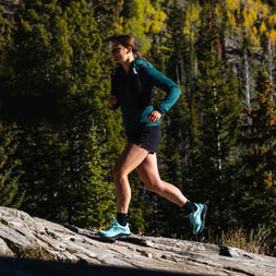 Ultraventure 4 - Women by Topo Athletic in blue, lightweight trail running shoes with roomy toe box ideal for rugged outdoor trails