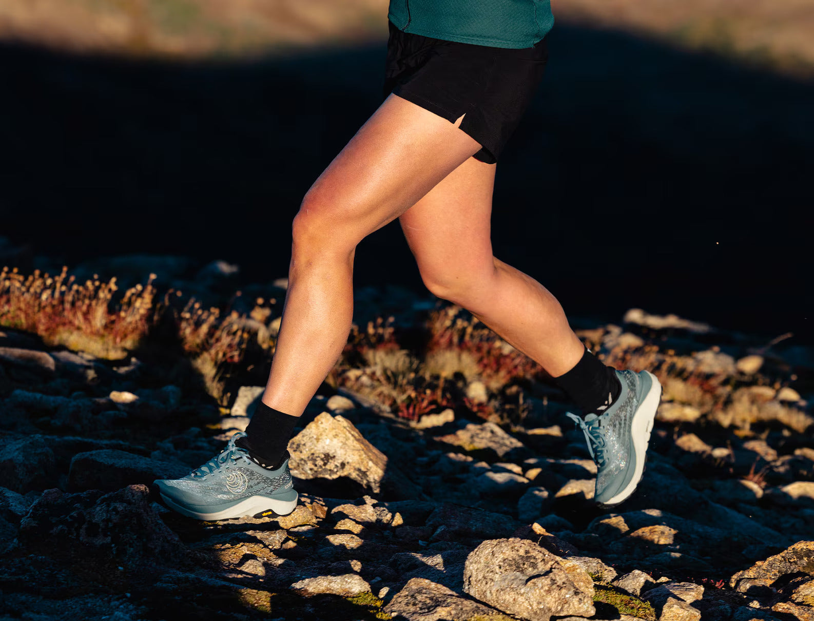 Ultraventure 4 - Women by Topo Athletic in grey and blue, lightweight trail runner with roomy toe box for comfort on rugged terrain