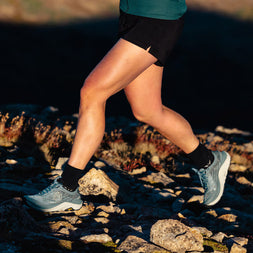 Ultraventure 4 - Women by Topo Athletic in grey and blue, lightweight trail runner with roomy toe box for comfort on rugged terrain