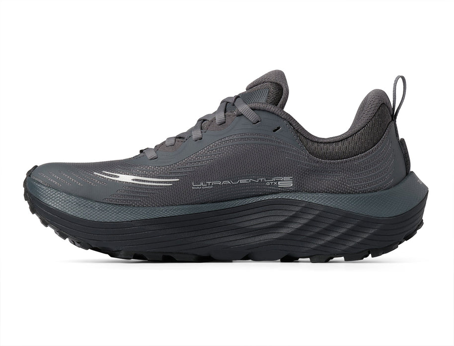 Inner side of the Topo Ultraventure 5 GTX women's trail running shoe in Grey/Butter with dark midsole