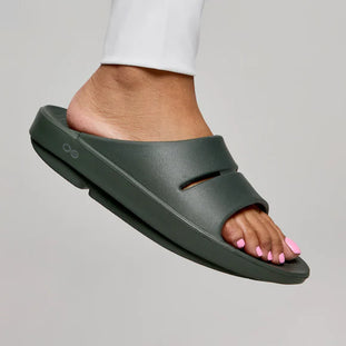 OOahh - Unisex by Oofos in dark green with agile OOfoam strap for impact absorption, ideal for comfort and recovery use