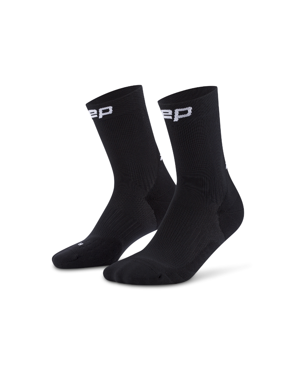 Core Run Socks Mid Cut, 5.0 - Women by CEP Sports in black, compression socks with targeted zones for support and muscle activation during running