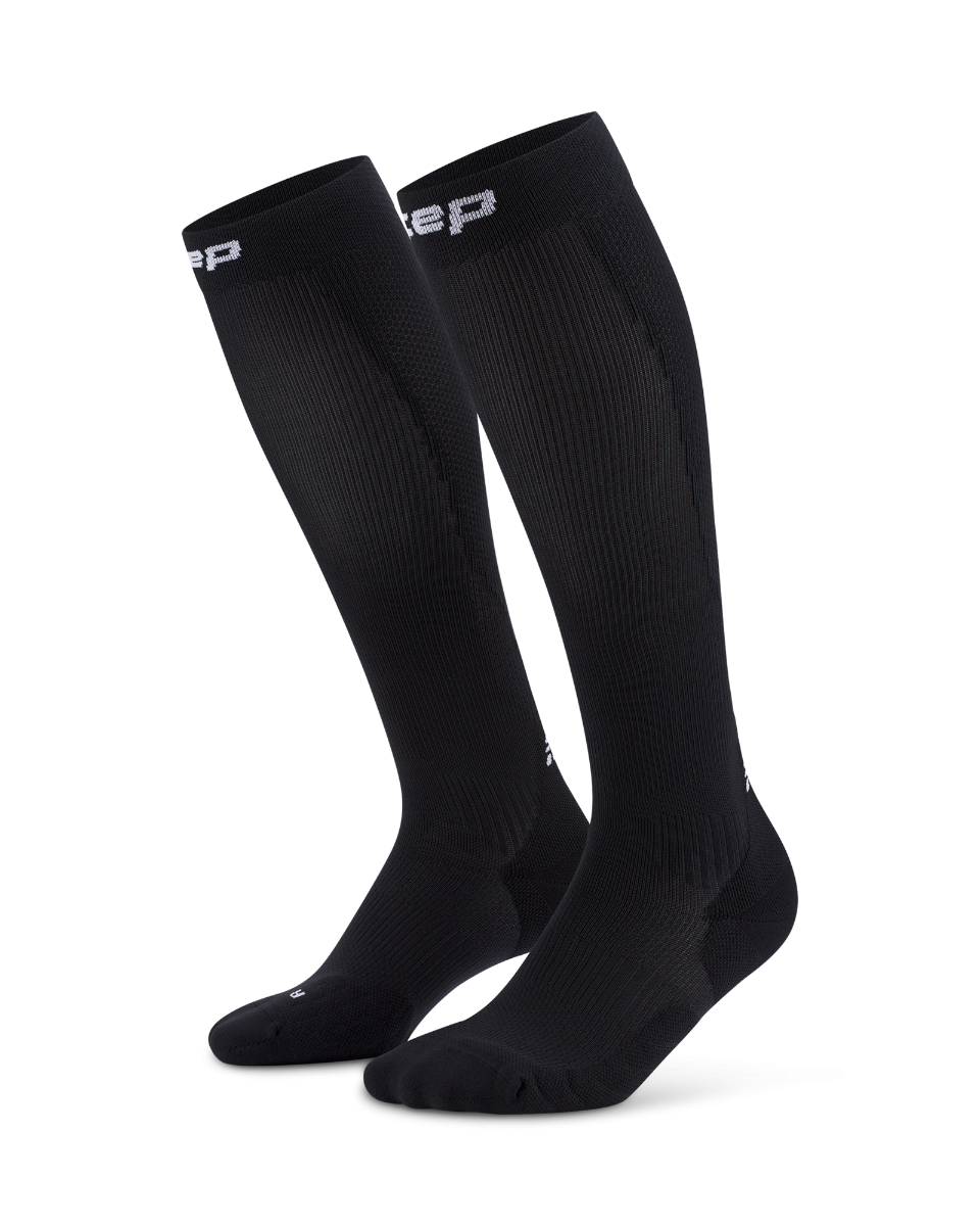 Core Run Socks Tall, 5.0 - Women by CEP Sports in black, high compression running socks for enhanced activation and support during running