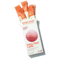 Instant Coffee: Dirty Chai Latte by Alpine Start in orange and white packaging, instant Colombian Arabica coffee with chai spices and soy milk, bold creamy flavor