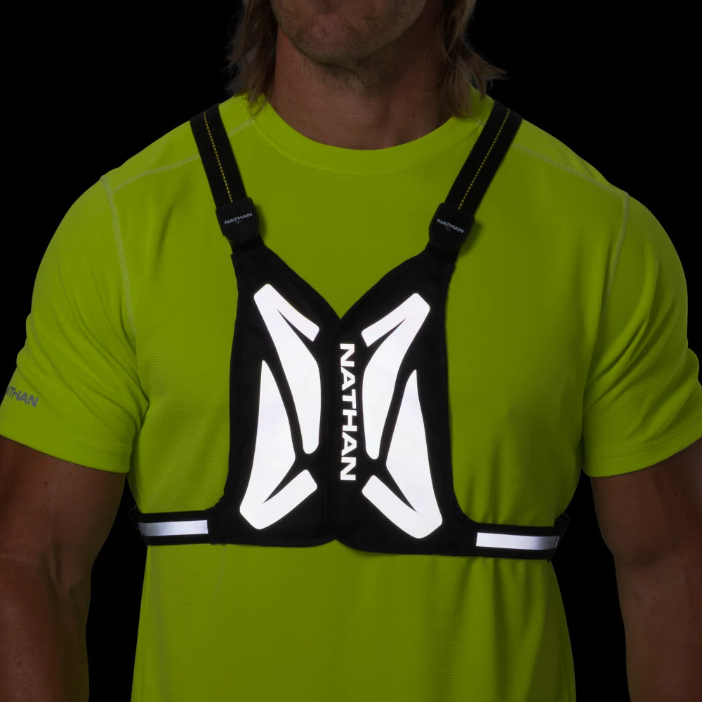 Laser Light Web Vest by Nathan in black with LED thread and reflective web, lightweight safety vest for low light running and outdoor use