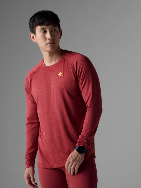 Man wearing the Rabbit EZ Tee LS men's long sleeve tee in Garnet with red shorts, front view