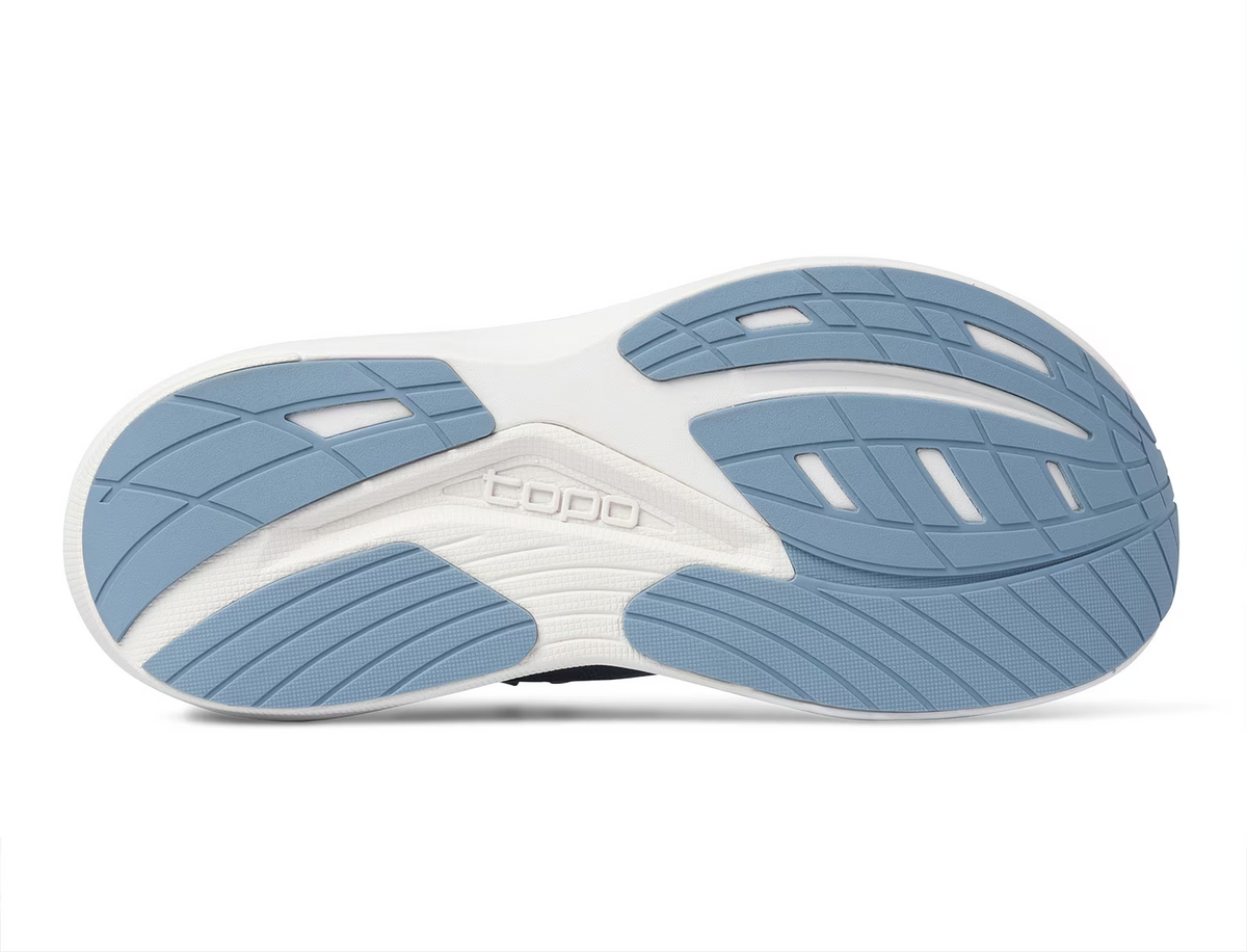 Outsole of the Topo Ultrafly 6 women's road running shoe in Blue/White with blue rubber pads