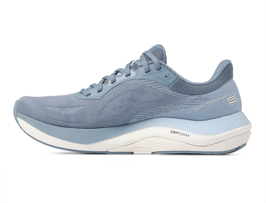 Inner side of the Topo Ultrafly 6 women's road running shoe in Blue/White with pale blue midsole