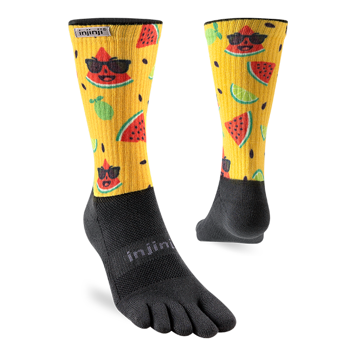 Pair of Injinji The Courtney Crew women's toe socks in Solar Slice, yellow watermelon print with black toes, side and back