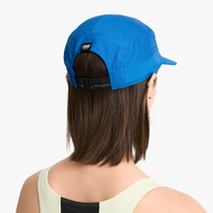 Back of a woman's head wearing the Ciele GOCap Comp Ninety in Azure with adjustable strap