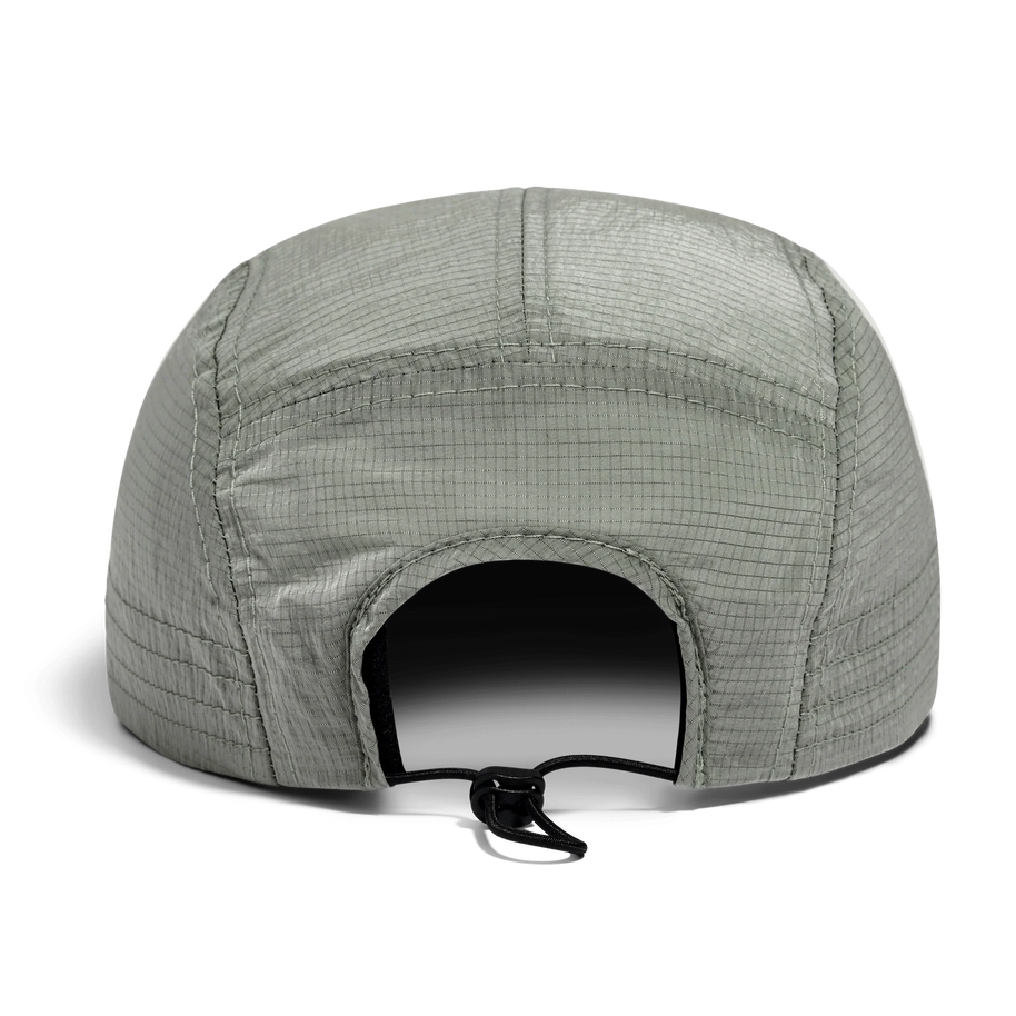 Back view of the Norda Luster Cap in Sage showing the bungee cord adjuster