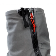 Close-up of the zip and top buckle on the grey Kahtoola LEVAgaiter GTX Mid in Cardinal