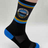 Run to Beer Socks by Outway in black with blue and yellow stripes, supportive socks promoting trail maintenance by United Riders of Cumberland