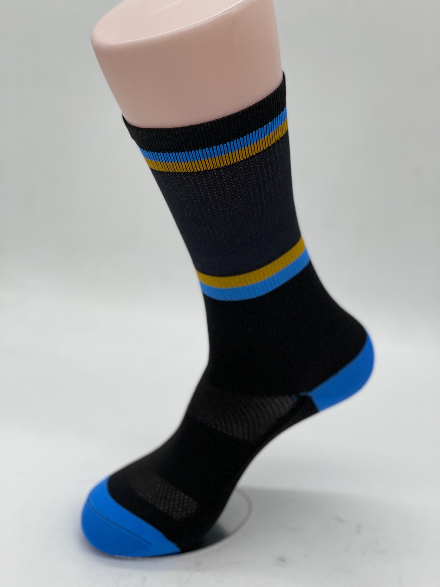 Run to Beer Socks by Outway in black with blue and gold stripes, breathable socks supporting trail maintenance by United Riders