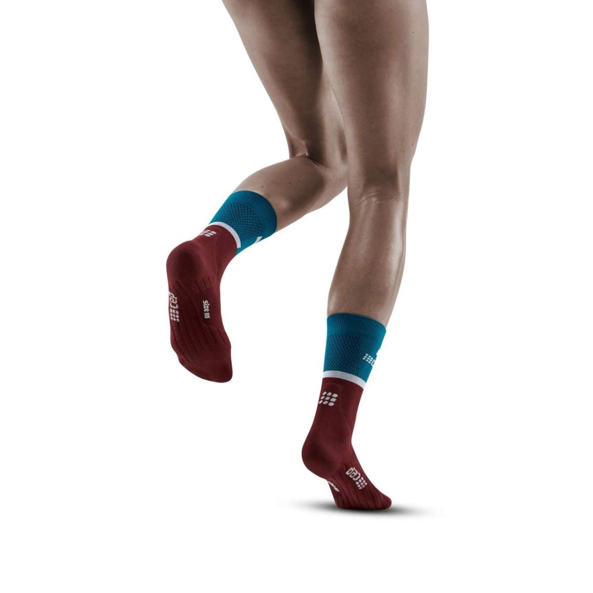 Run Compression Socks 4.0 Mid Cut - Women by CEP Sports in burgundy and blue, stabilizing joints with medi compression for injury prevention during running