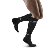 Run Compression Socks Tall - Men by CEP Sports in black, targeted medi compression reducing muscle vibrations, ideal for running.