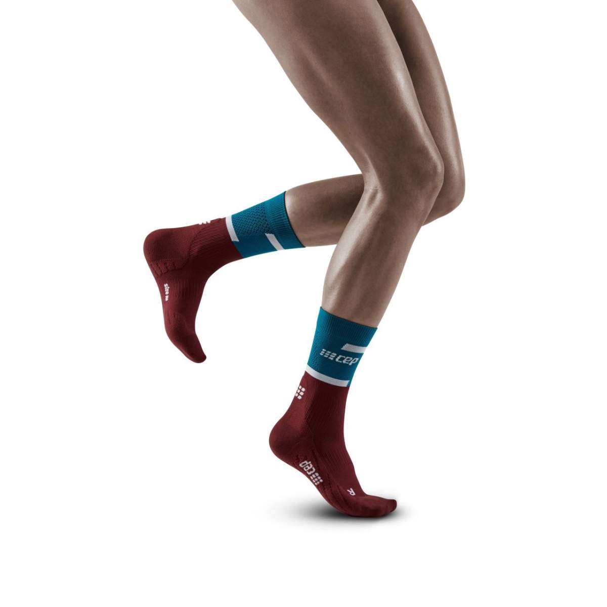 Run Compression Socks 4.0 Mid Cut - Women by CEP Sports in red and blue, compression socks stabilizing joints to reduce injuries for running.