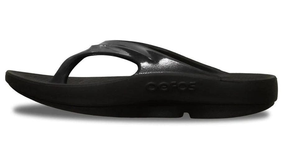 OOlala - Women by Oofos in black slide sandal with patented OOfoam footbed absorbing 37% more impact for all-day comfort