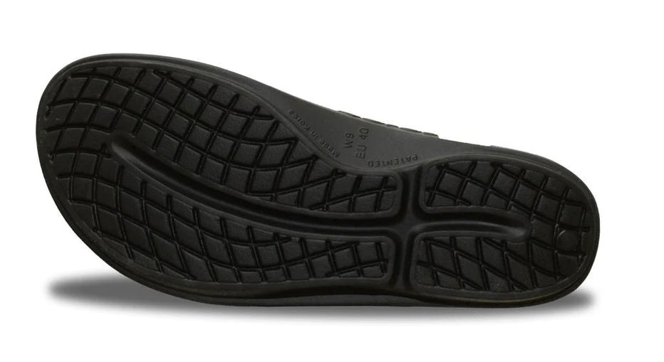 OOlala - Women by Oofos in black slide sandal with patented OOfoam footbed absorbing 37% more impact for all-day comfort