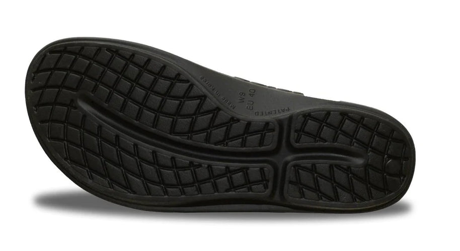 OOlala - Women by Oofos in black slide sandal with patented OOfoam footbed absorbing 37% more impact for all-day comfort