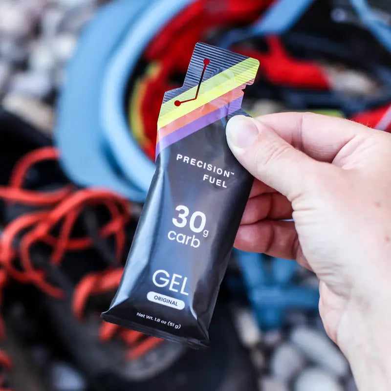 PF Gel by Precision Fuel & Hydration in black with rainbow detail, citrus-flavored gel providing 30g carbs for fast nutrition during running and endurance