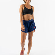 Fuel 'N Fly 4 - Women by Rabbit in navy blue running shorts with five pockets including back zip, designed for long runs and essentials