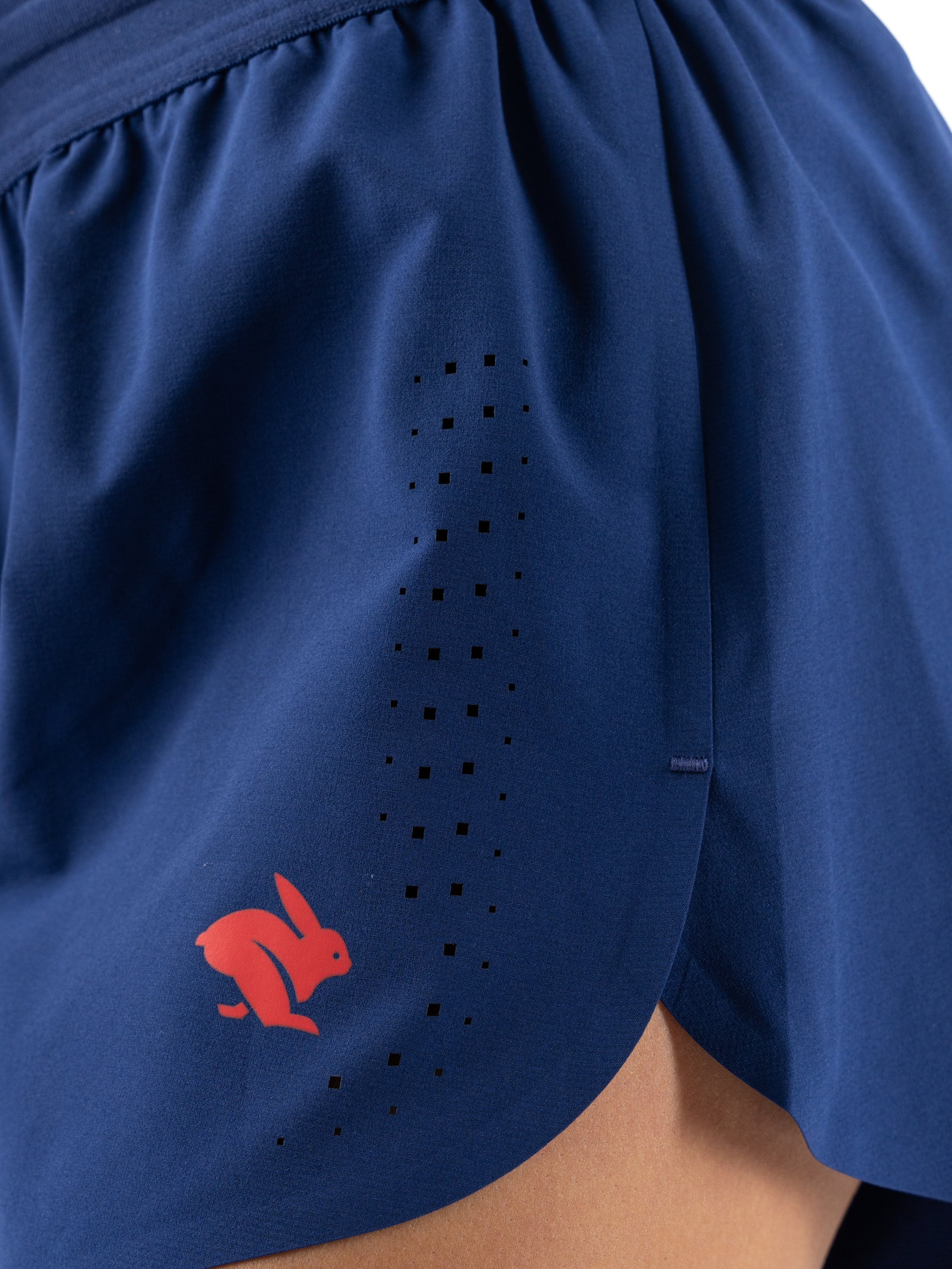 Fuel 'N Fly 4 - Women by Rabbit in moonlight blue with five pockets including back zip, versatile running shorts for long-distance comfort