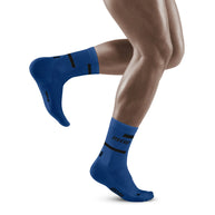 Run Compression Socks 4.0 Mid Cut - Men by CEP Sports in blue with medi compression to stabilize joints and reduce running injuries