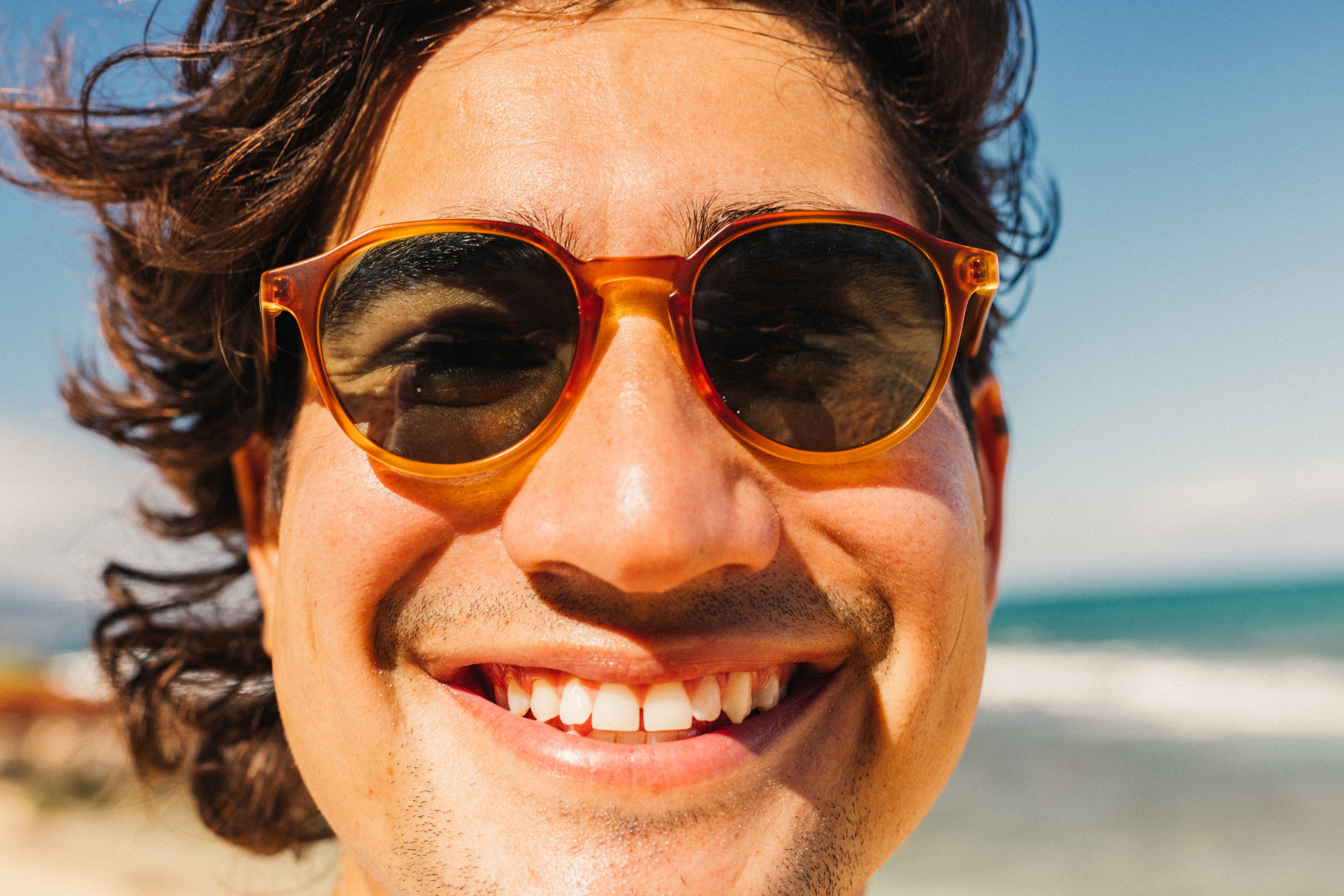 Vallarta sunglasses by Sunski in amber with sculpted arms, lightweight design ideal for men and women dressing up or casual wear