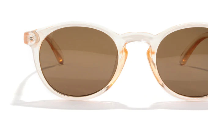 Dipsea by Sunski in translucent peach frame with brown lenses, round sunglasses blending city style and outdoor spirit for men and women