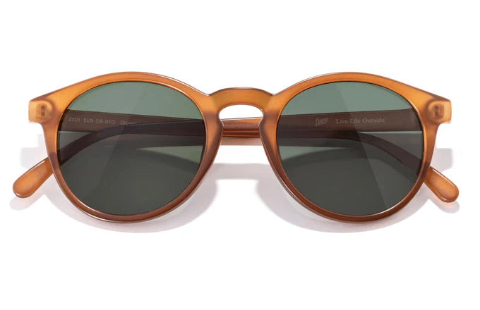 Dipsea by Sunski in amber translucent with green lenses, lightweight round frame glasses blending city style and outdoor spirit