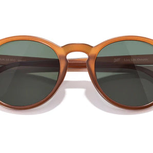 Dipsea by Sunski in amber translucent with green lenses, lightweight round frame glasses blending city style and outdoor spirit