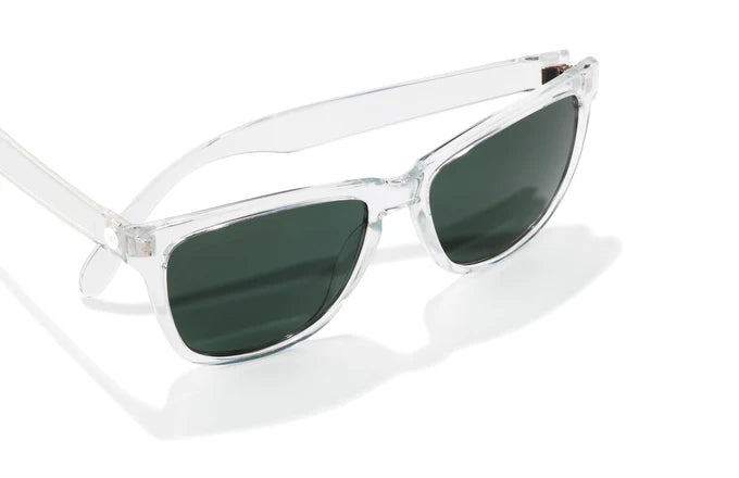 Headland by Sunski in clear frame with dark green lenses, classic rectangular wayfarer sunglasses for men and women outdoor use