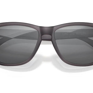 Headland sunglasses by Sunski in matte black with rectangular wayfarer shape, medium size, ideal for outdoor use and hiking.