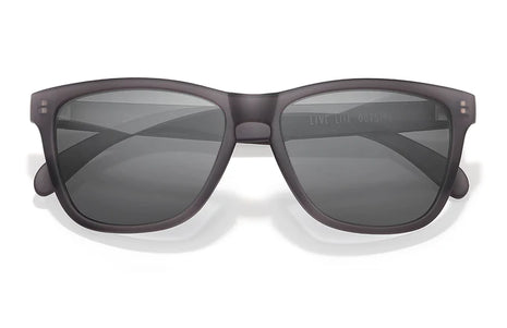 Headland sunglasses by Sunski in matte black with rectangular wayfarer shape, medium size, ideal for outdoor use and hiking.