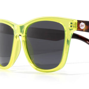 Headland sunglasses by Sunski in translucent yellow and tortoise with classic rectangular wayfarer shape for men and women