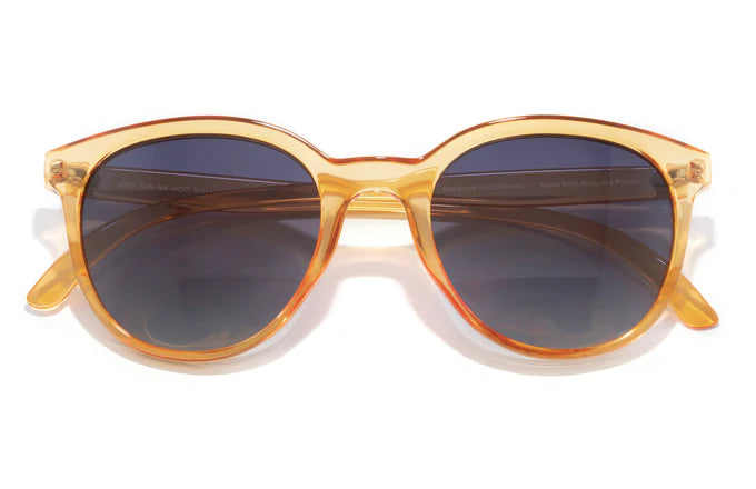 Makani by Sunski in translucent amber with polarized lenses and SuperLight recycled frames for all-day comfort and style.