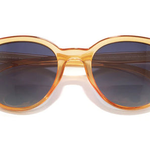 Makani by Sunski in translucent amber with polarized lenses and SuperLight recycled frames for all-day comfort and style.