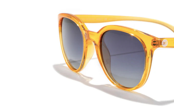 Makani by Sunski in translucent amber with polarized lenses and lightweight recycled frames for all-day comfort and stylish outdoor use