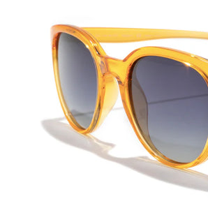 Makani by Sunski in translucent amber with polarized lenses and lightweight recycled frames for all-day comfort and stylish outdoor use