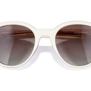 Makani by Sunski in white with brown polarized lenses, lightweight recycled frame with cat eye shape for all-day comfort and style