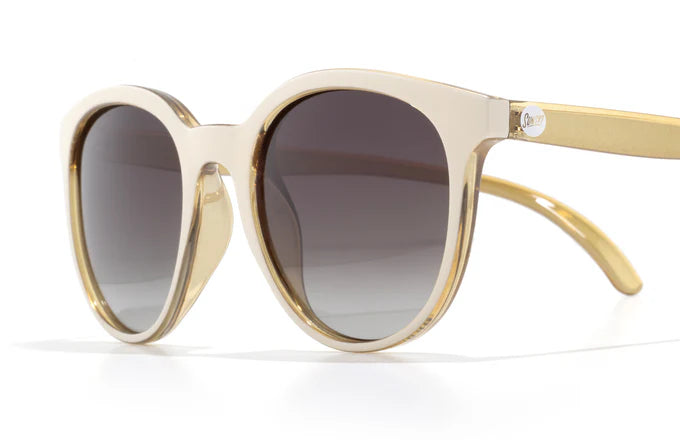 Makani by Sunski in beige and gold with polarized lenses, SuperLight recycled frames, cat eye shape for all-day comfort and style