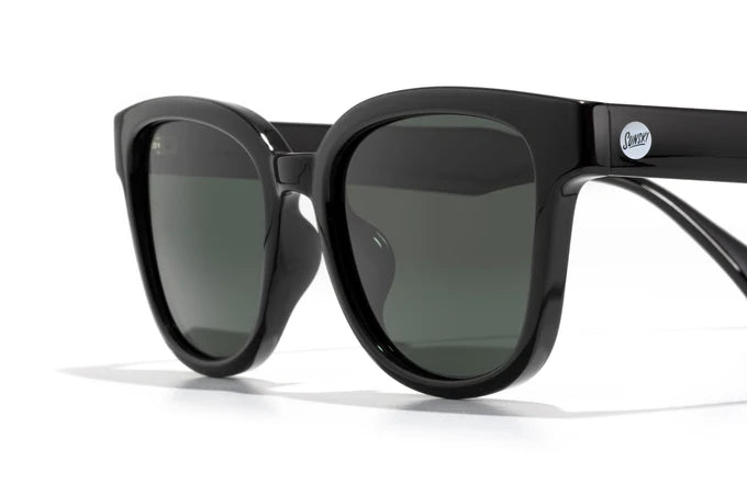 Miho by Sunski in black with dark green lenses, stylish sunglasses with timeless curved design ideal for beach and casual wear