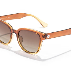 Miho sunglasses by Sunski in amber and yellow with nature-inspired lenses, timeless shape, ideal for beach and brunch wear