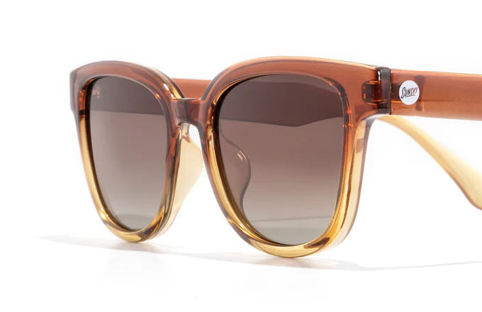 Miho sunglasses by Sunski in amber and brown with nature-inspired lenses, timeless curved frame ideal for beach and brunch wear